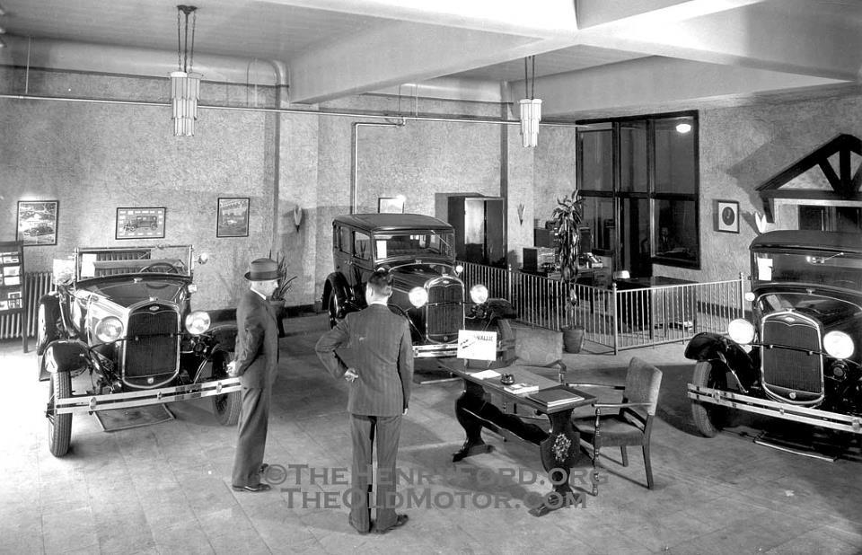 A period Ford Salesroom featuring Ford Model A's.